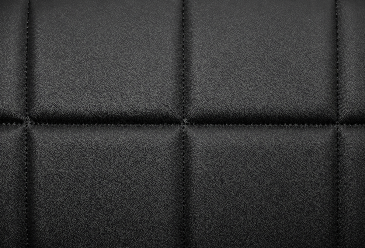 Close-up of the quilted black vinyl upholstery on the Baja bench seat