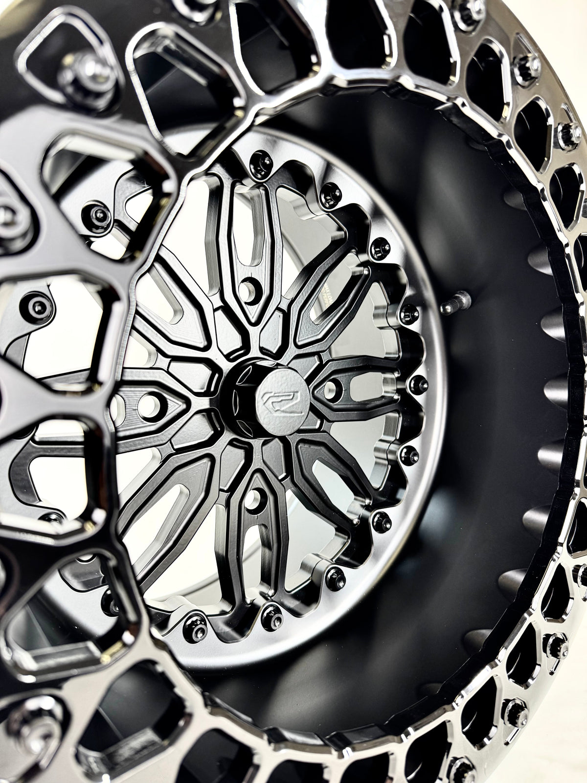 Close-up of a Packard Icon Midnight beadlock UTV wheel with a satin black barrel.