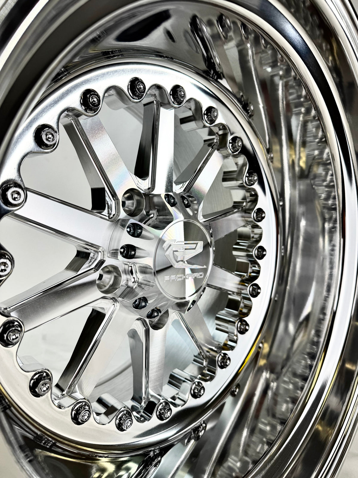 Close-up of a Packard Element silver non-beadlock UTV wheel with a polished barrel.