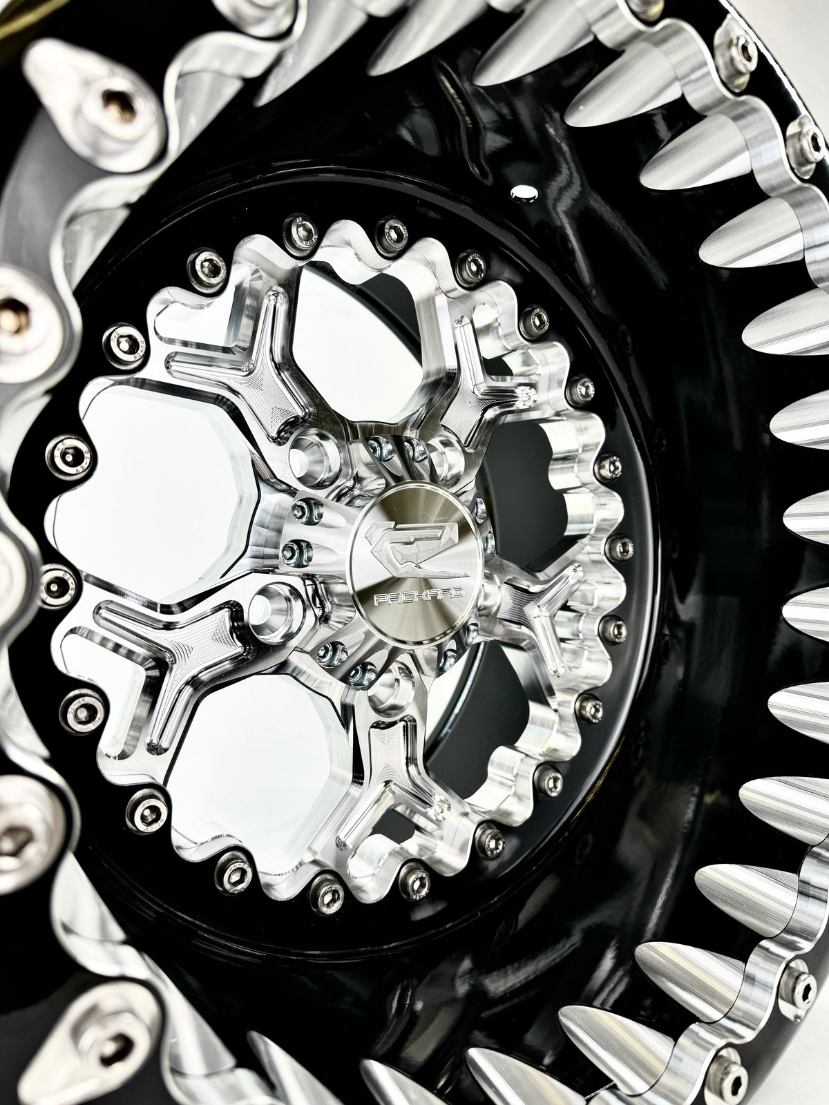 Close-up of a Packard Pro 5 silver beadlock UTV wheel with a black barrel.