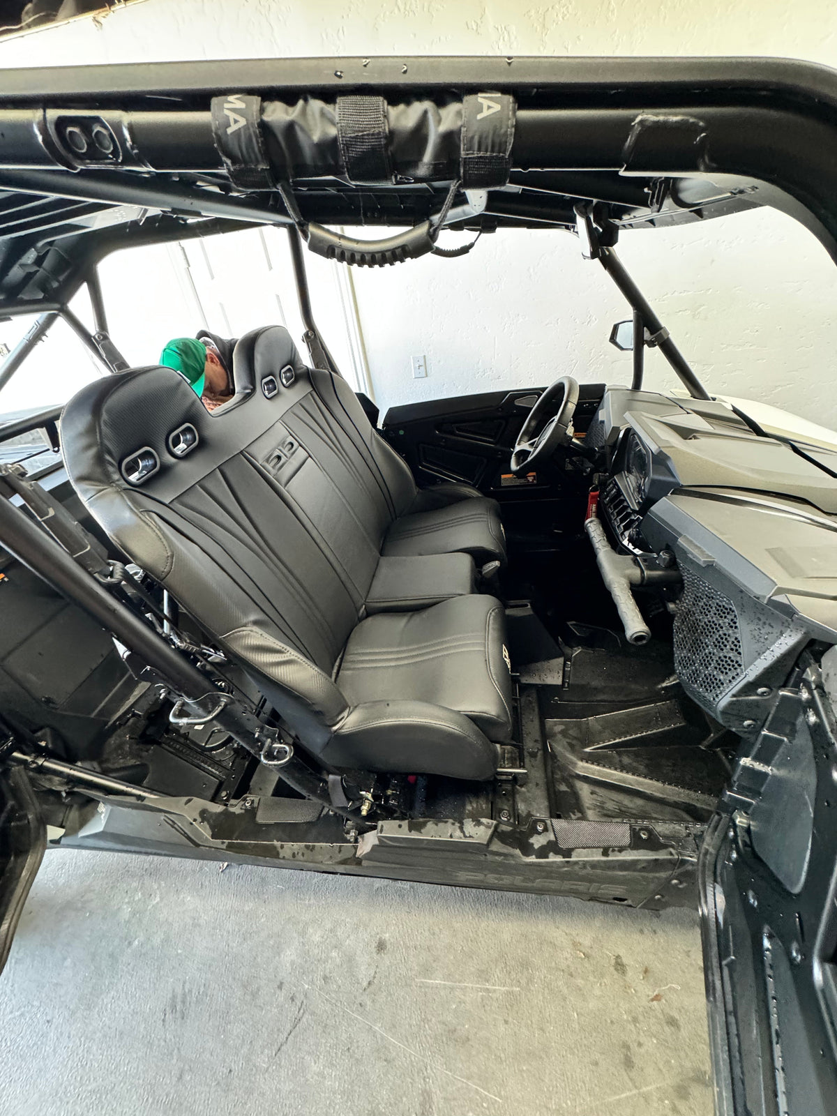 Black bench seat installed beside a side-by-side dashboard
