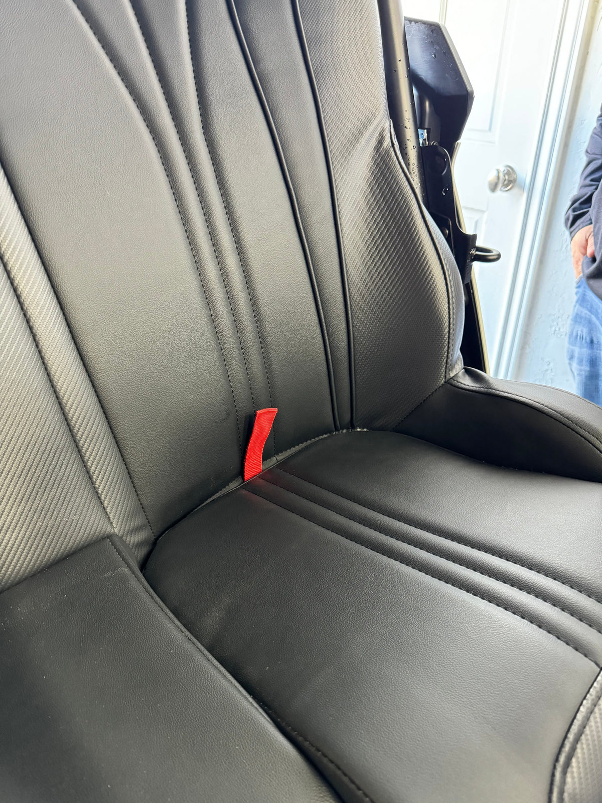 Close-up of the removable black bench-seat cushion