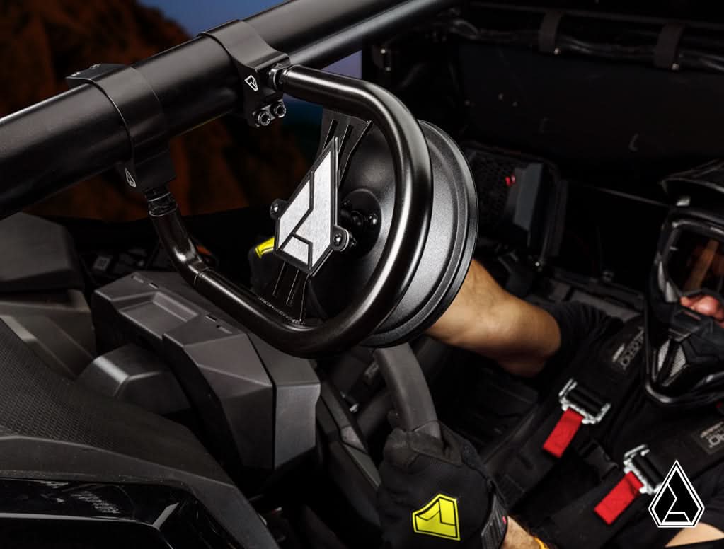 Assault Insurgent round side mirror mounted on a UTV roll cage