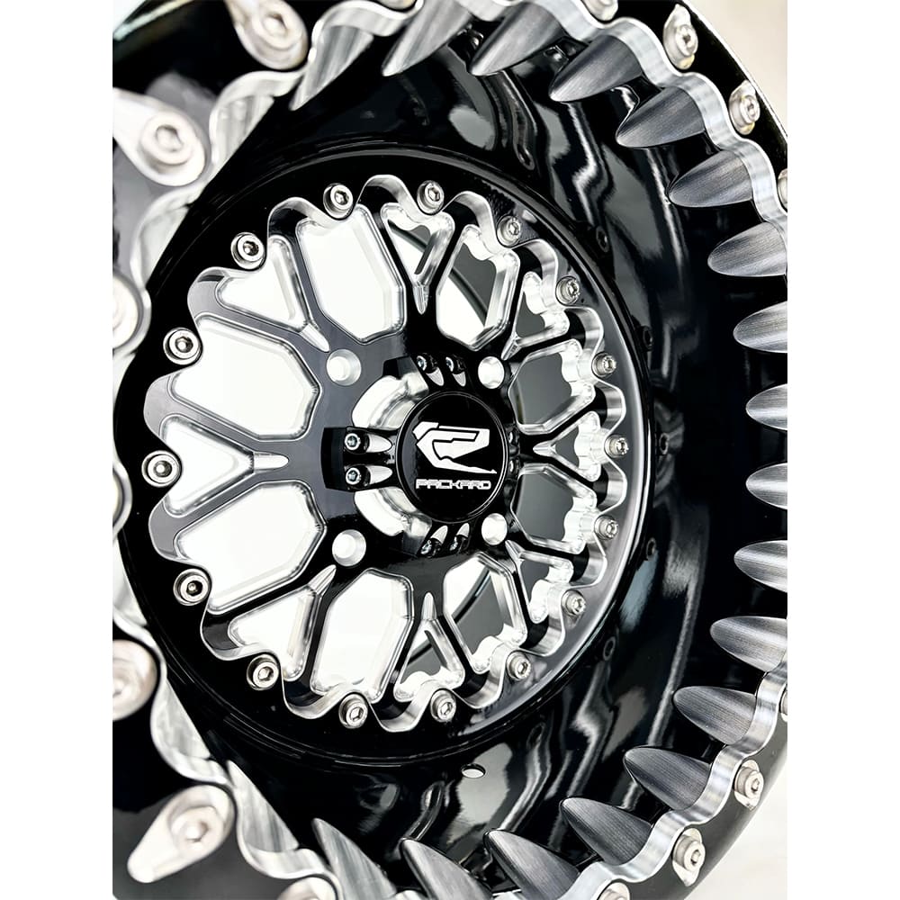 Close-up of a Packard Wishbone gloss black beadlock UTV wheel with a black barrel.