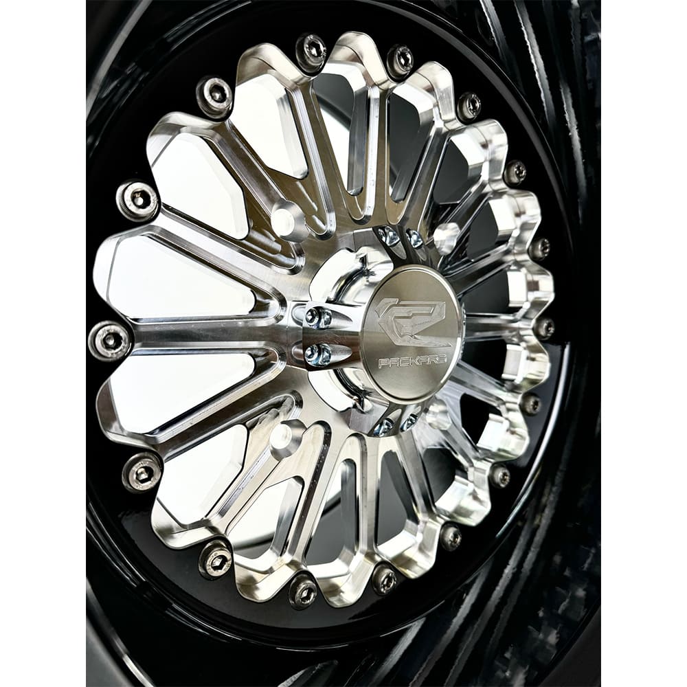 Close-up of a Packard Element silver non-beadlock UTV wheel with a black barrel.