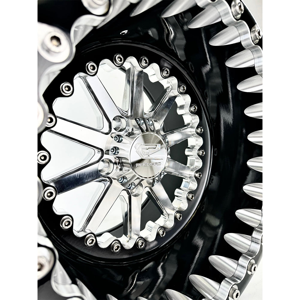 Close-up of a Packard Element silver beadlock UTV wheel with a black barrel.
