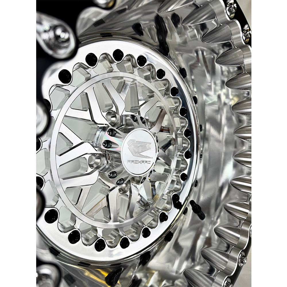 Close-up of a Packard Apollo silver beadlock UTV wheel with a polished barrel.