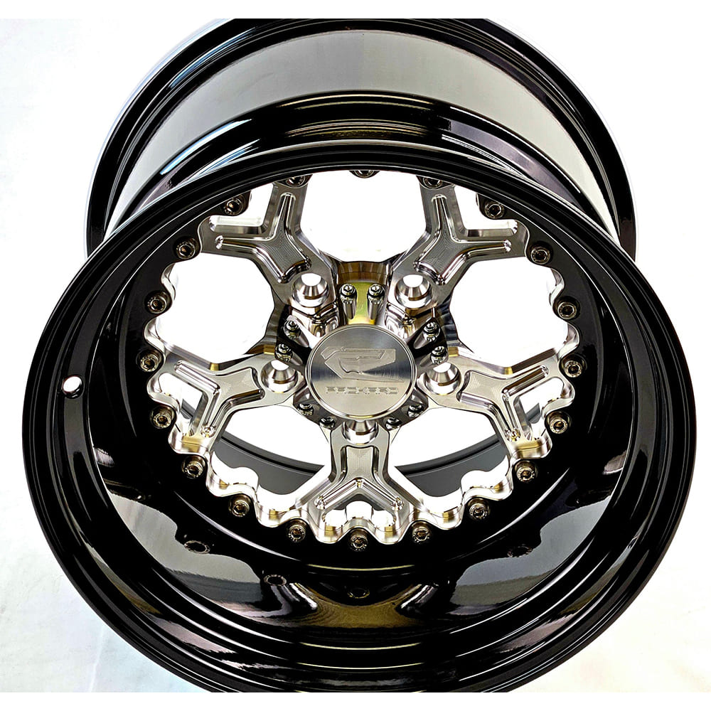 Angled view of a Packard Pro 5 silver non-beadlock UTV wheel with a black barrel.