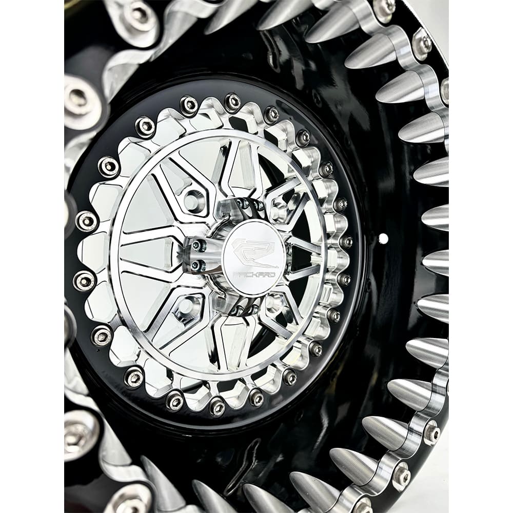 Close-up of a Packard Apollo silver beadlock UTV wheel with a black barrel.