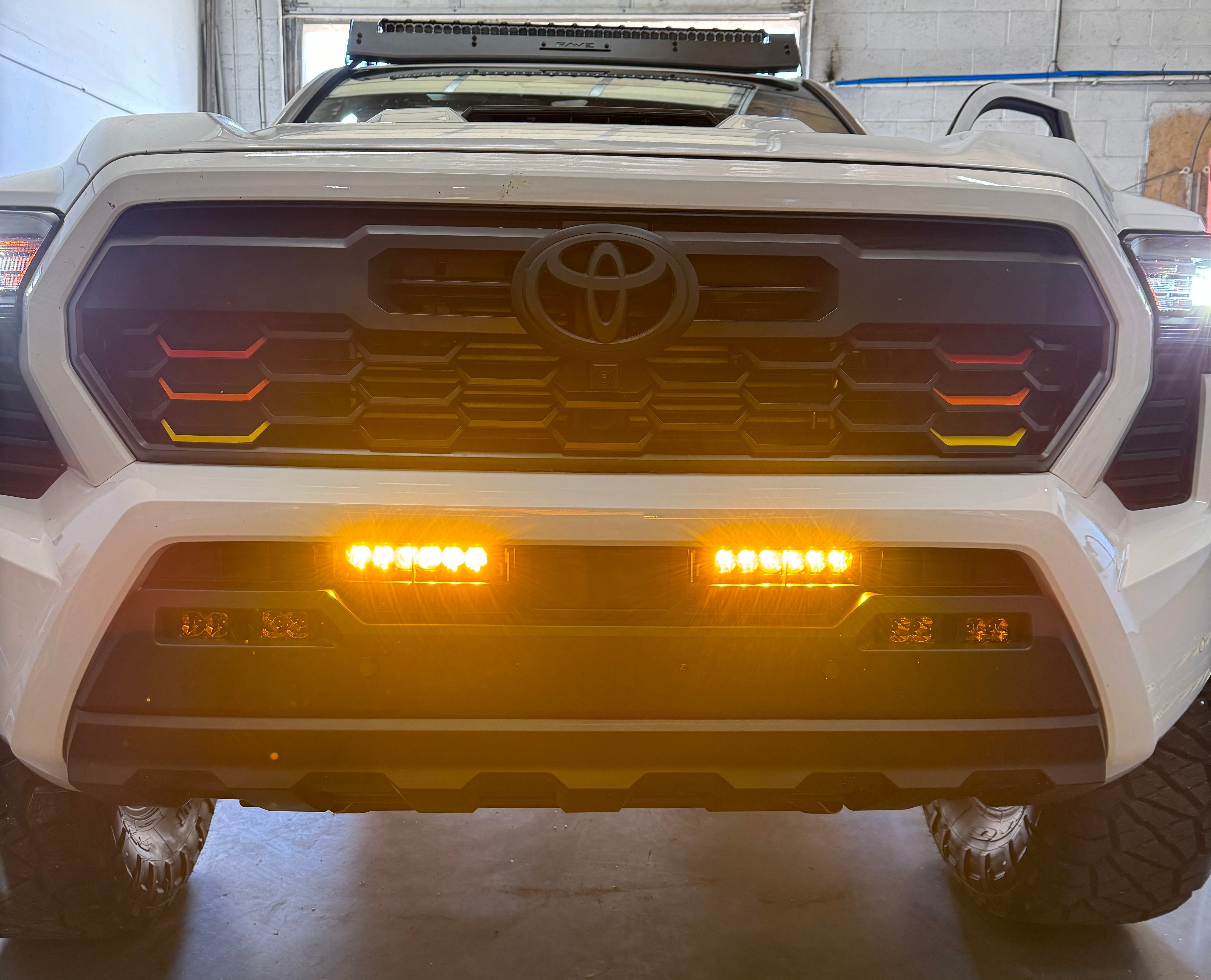 Photo of 4th Gen Tacoma Behind the Grill Dual 6" Bar Kit - Amber Lens by Heretic Studio Dealer Portal - Premium Light Bar for UTVs / Side by Sides