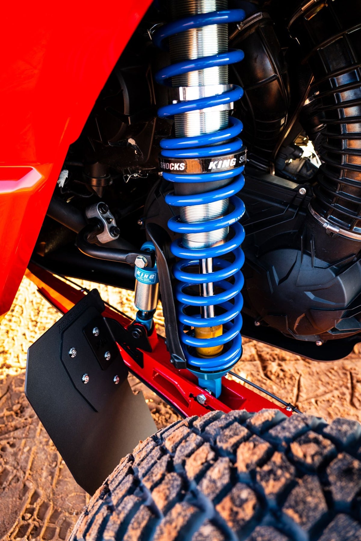 HCR trailing arm guard fitted beside a Can-Am Maverick X3 rear shock