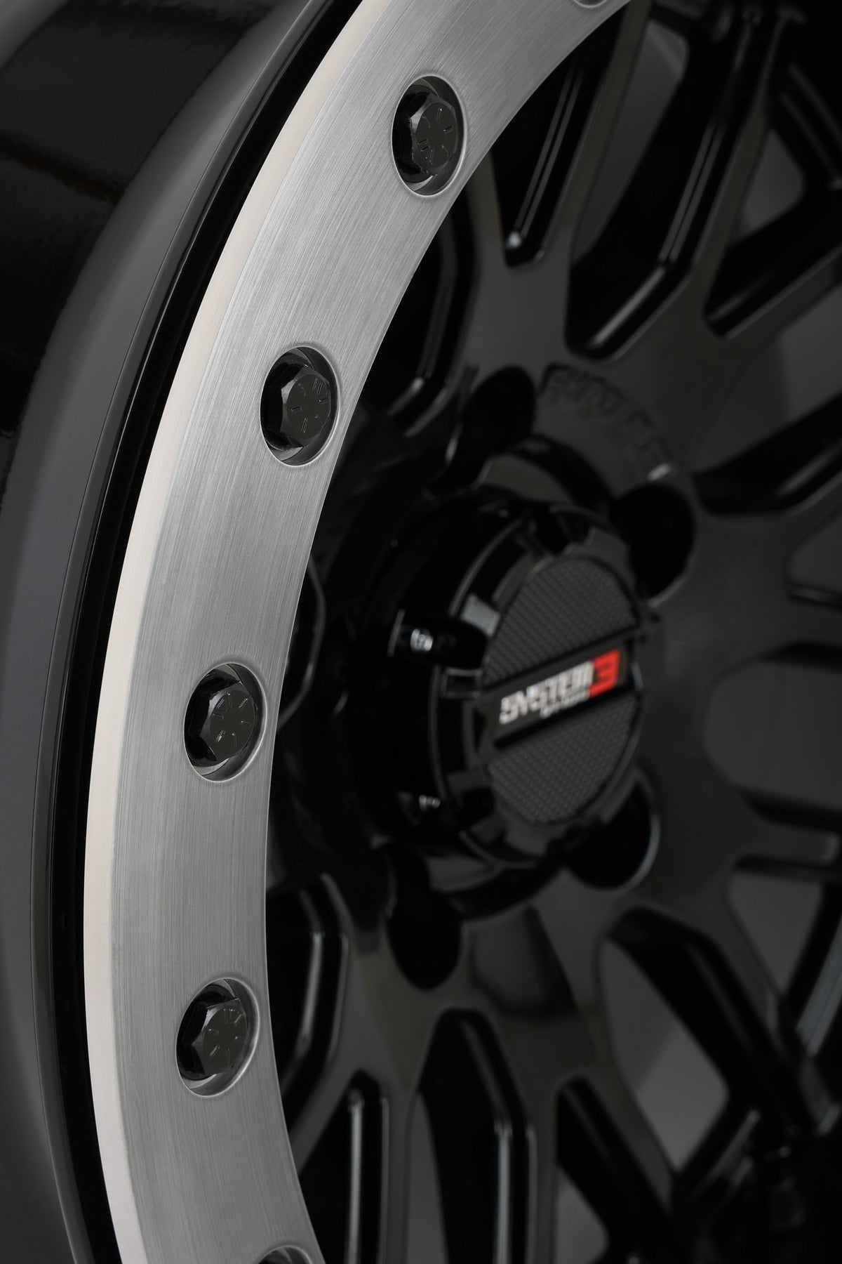 Photo of SYSTEM 3 SB9 WHEEL 15X9 5+4 (+10MM) 5/4.5 GLOSS BLACK by SYSTEM 3 - Premium Wheels for UTVs / Side by Sides