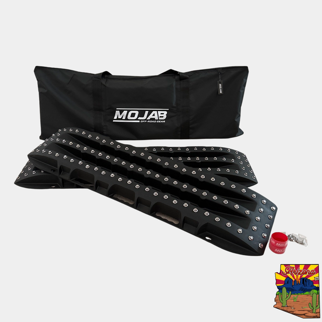 Ultimate Traction recovery board with steel plugs and storage bag.