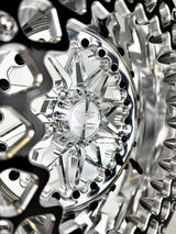 Close-up of a Packard Impact silver beadlock UTV wheel with a polished barrel.
