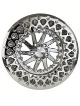 Front view of a Packard Cyclone silver beadlock UTV wheel with a polished barrel.