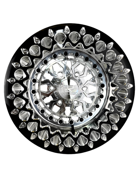 Angled view of a Packard Apollo silver beadlock UTV wheel with a polished barrel.