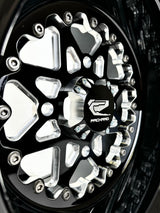 Close-up of a Packard V2 Super Star gloss black non-beadlock UTV wheel with a black barrel.