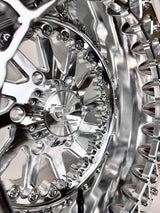 Close-up of a Packard Cyclone silver beadlock UTV wheel with a polished barrel.