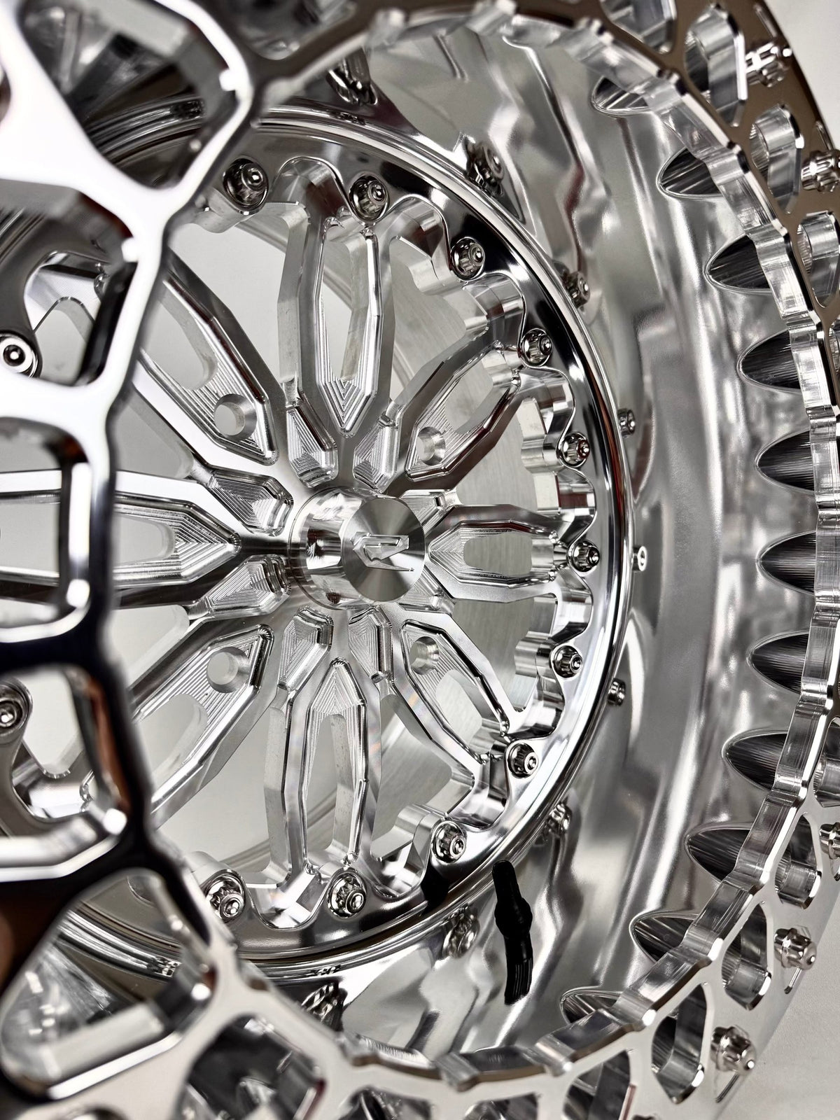 Close-up of a Packard Icon silver beadlock UTV wheel with a polished barrel.