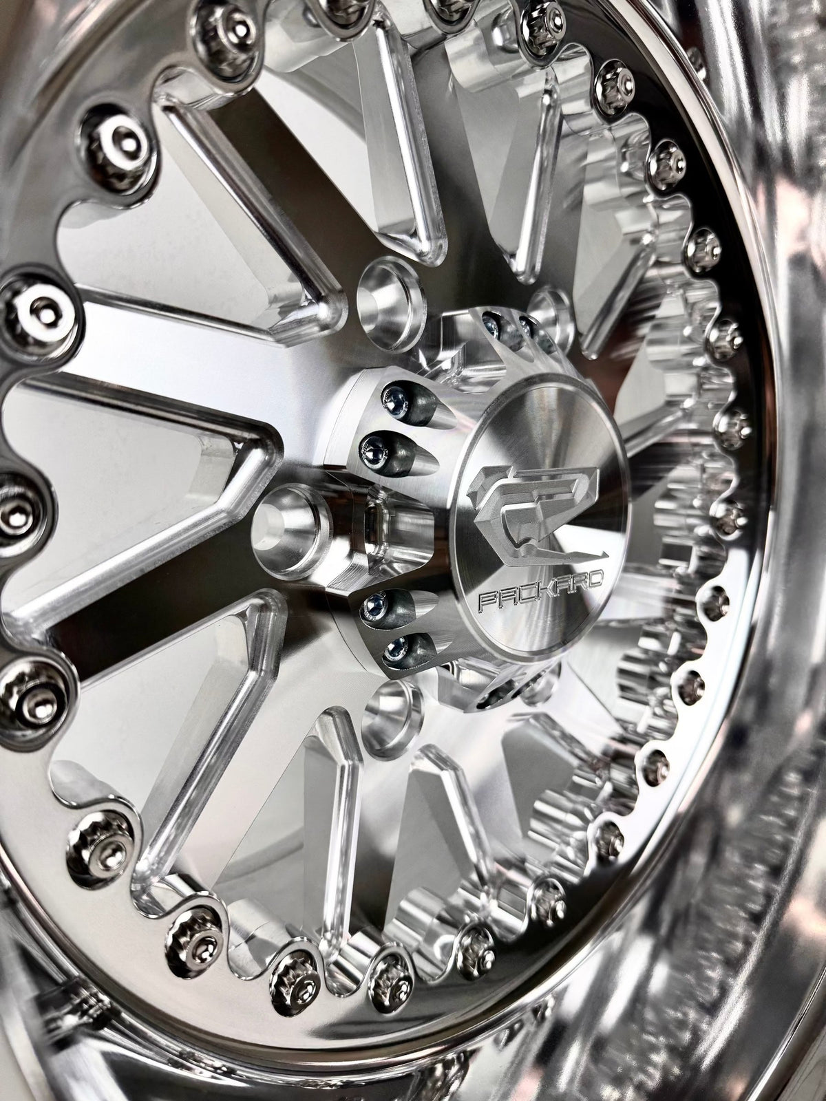 Close-up of a Packard Cyclone silver non-beadlock UTV wheel with a polished barrel.