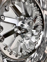Close-up of a Packard Cyclone silver non-beadlock UTV wheel with a polished barrel.