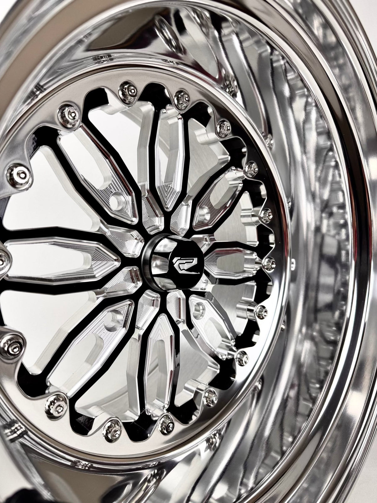 Close-up of a Packard Icon gloss black non-beadlock UTV wheel with a polished barrel.
