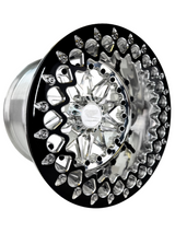 Angled view of a Packard Impact silver beadlock UTV wheel with a polished barrel.
