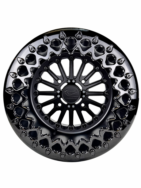 Angled view of a Packard Element Midnight beadlock UTV wheel with a satin black barrel.