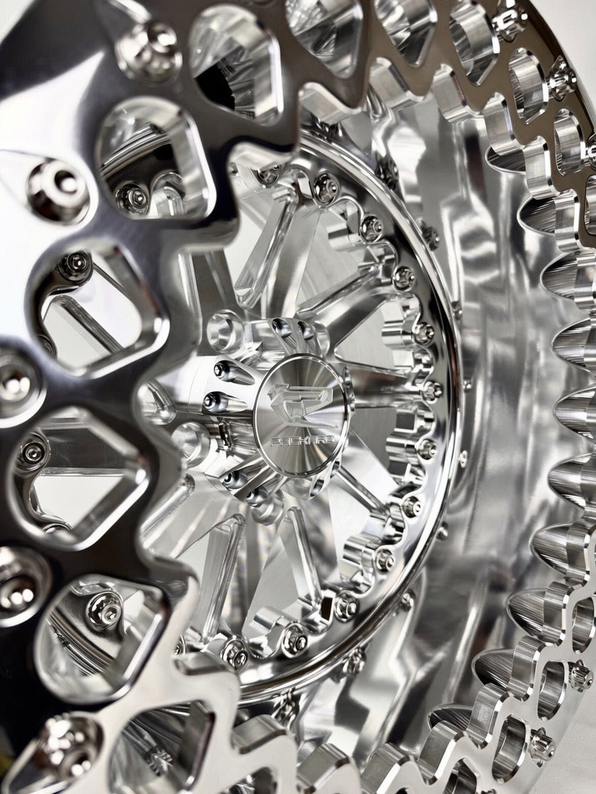 Close-up of a Packard Cyclone silver beadlock UTV wheel with a polished barrel.