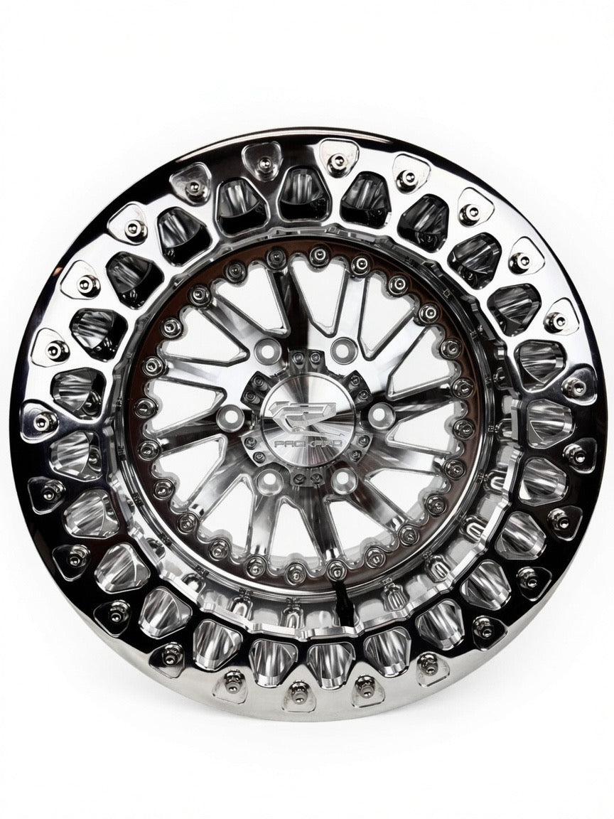 Front view of a Packard Cyclone silver beadlock UTV wheel with a polished barrel.