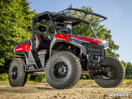 SuperATV UForce U10 Pro long travel kit — installed vehicle and 4-inch-per-side width increase
