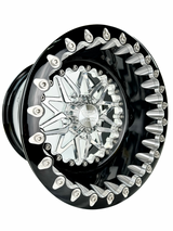 Angled view of a Packard Impact silver beadlock UTV wheel with a black barrel.