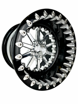 Angled view of a Packard Element silver beadlock UTV wheel with a black barrel.