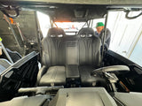 Black bench seat installed in a side-by-side cabin