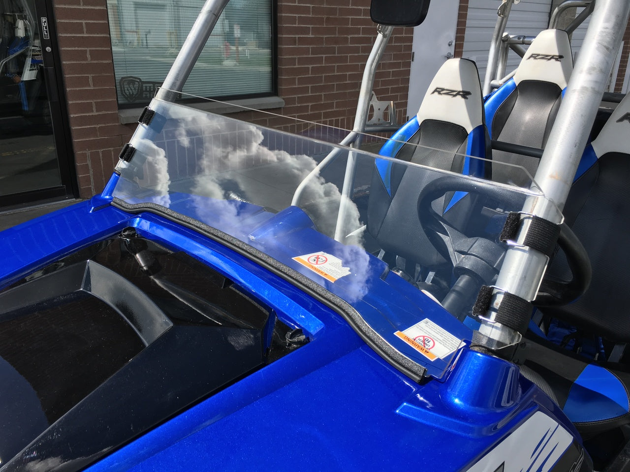 Photo of Polycarbonate Half Windshield with Quick Straps for RZR 570, 800, XP900 (upgrade options) by UTVZILLA - Premium for UTVs / Side by Sides