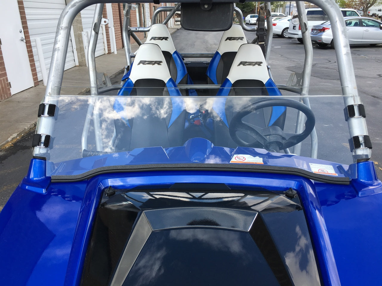 Photo of Polycarbonate Half Windshield with Quick Straps for RZR 570, 800, XP900 (upgrade options) by UTVZILLA - Premium for UTVs / Side by Sides