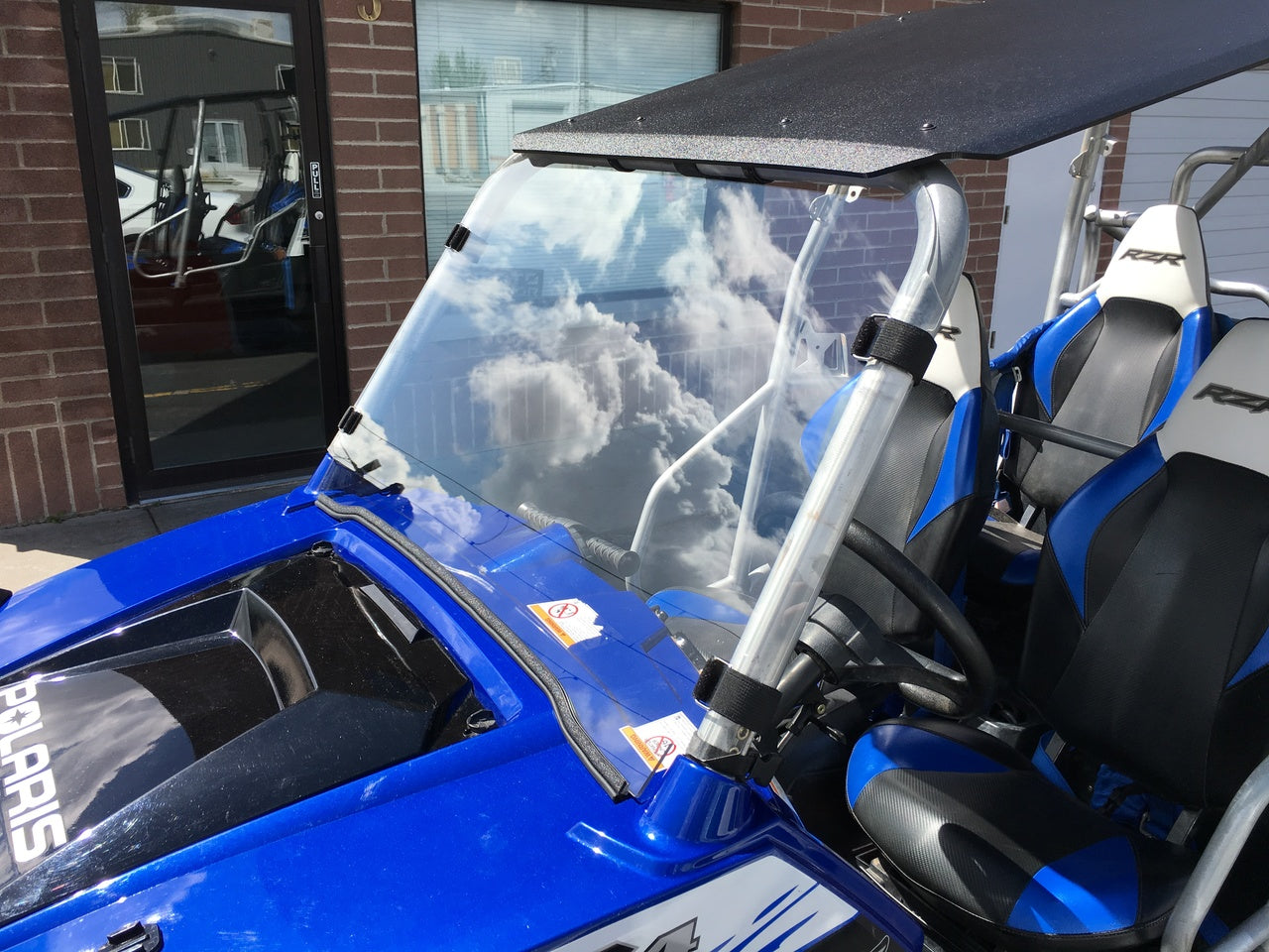Photo of Full Polycarbonate Windshield with Quick Straps for RZR 570, 800, XP900 (upgrade options) by UTVZILLA - Premium for UTVs / Side by Sides