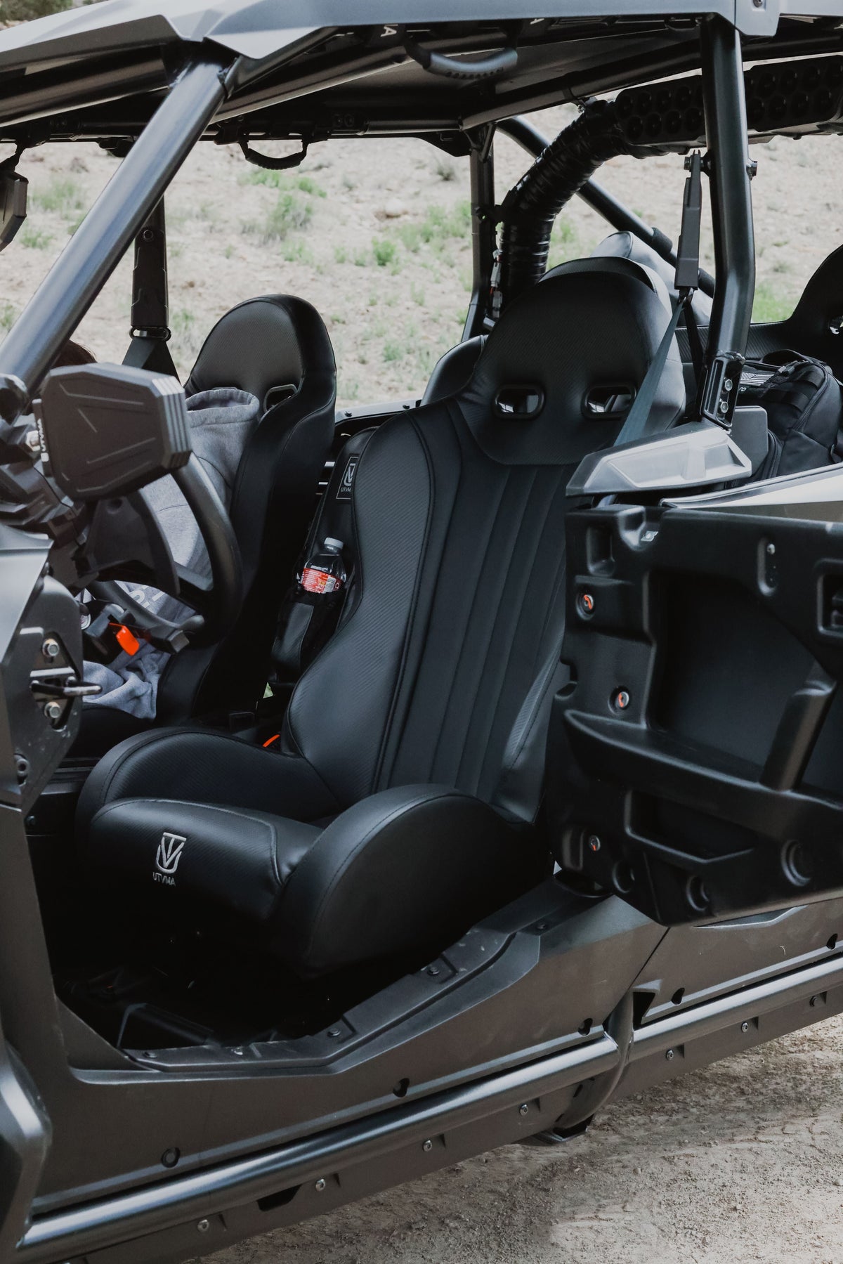 Black front bucket seats installed in a side-by-side cabin