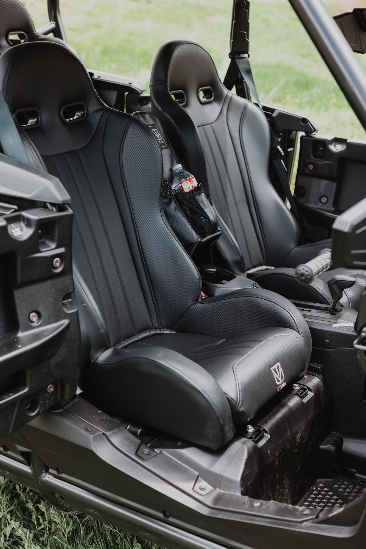 Pair of black front bucket seats installed in a side-by-side