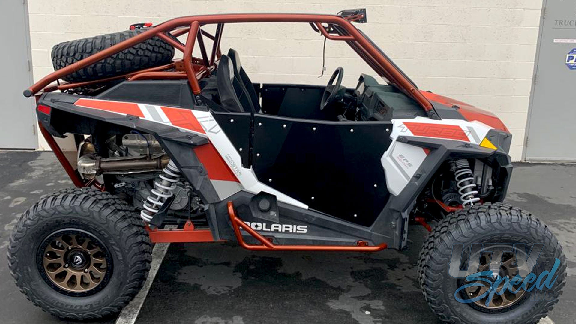 Photo of Opening Spare Tire Mount with shocks for the Polaris RZR 1000 by UTV Speed by UTV SPEED - Premium Accessories for UTVs / Side by Sides