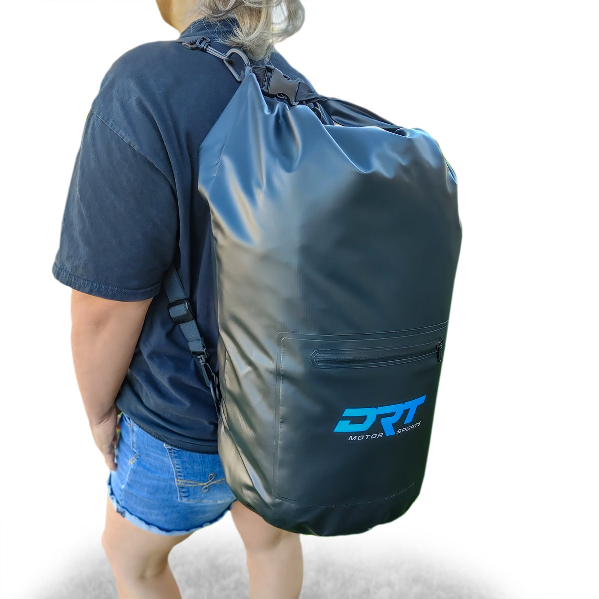 Angled view of the DRT 30-liter waterproof dry bag worn as a backpack for carrying gear.