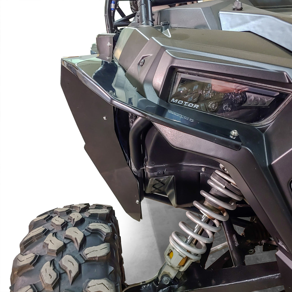Close-up of a DRT full-coverage ABS rear fender installed beside the RZR tail light and rear tire.