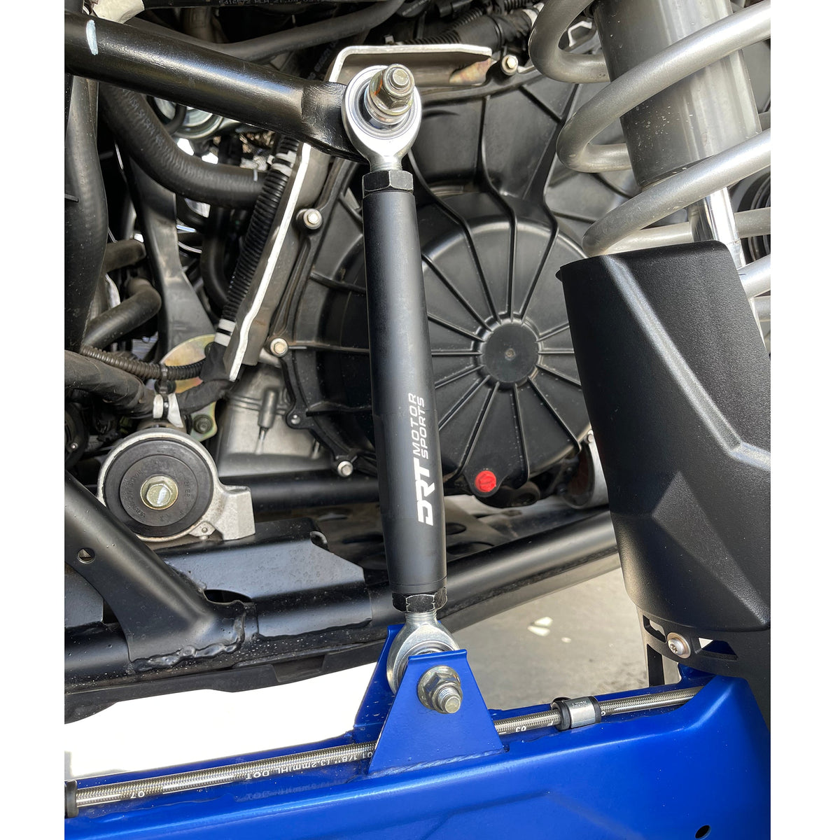 DRT billet barrel rear end link installed on a Polaris RZR Pro XP, showing suspension mounting points.