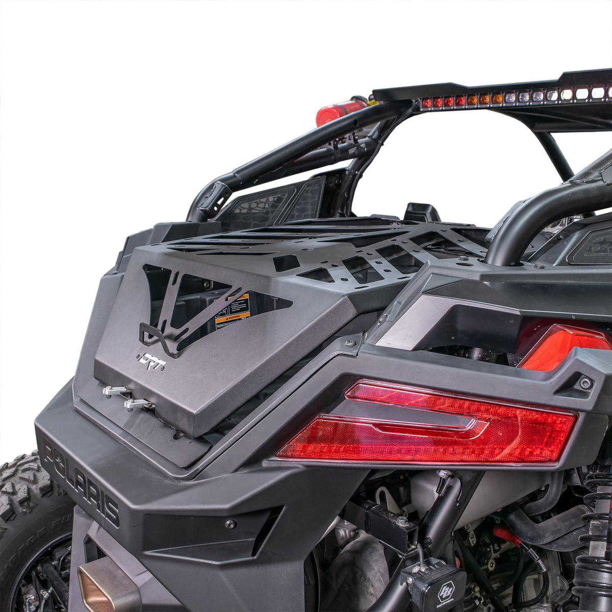 Rear three-quarter view of the DRT RZR adventure rack installed over the cargo bed.