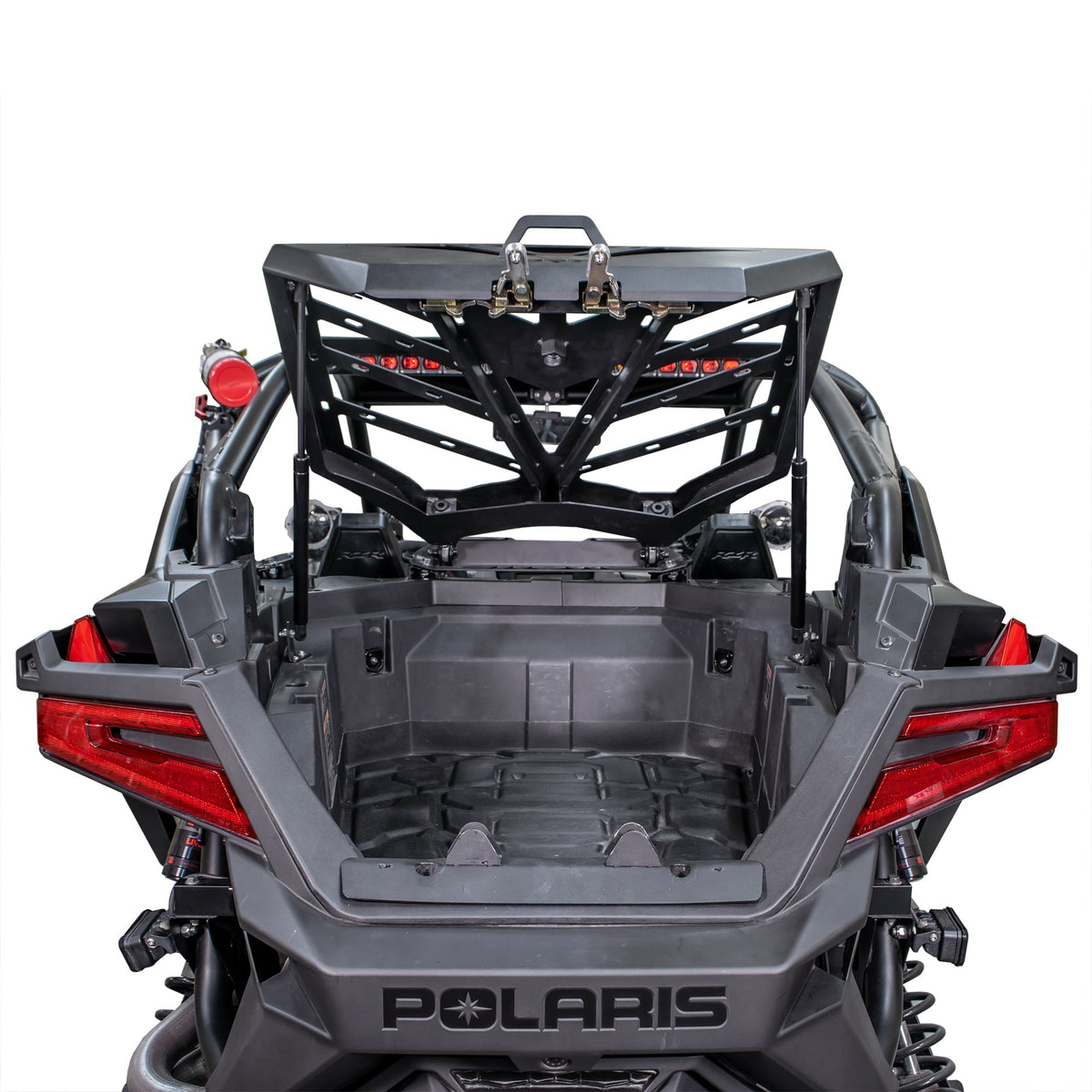 Rear view of the installed DRT RZR adventure rack raised to access the cargo bed.