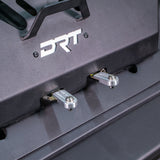Close-up of the installed DRT RZR adventure rack latch hardware.