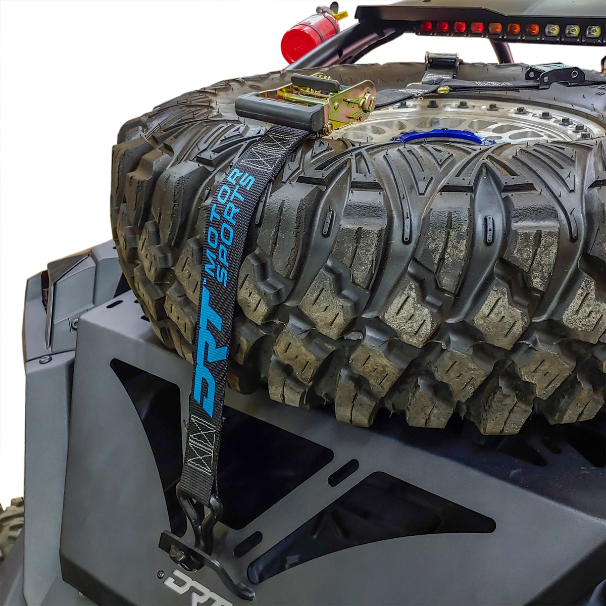 DRT RZR adventure rack installed with a spare tire secured above the rear cargo bed.