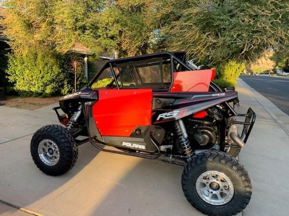Rear three-quarter view of a Polaris RZR RS1 with HCR trailing arms