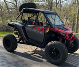 Hostile H133 Glamis wheels installed on a red 2024 Polaris RZR XP 1000 Ultimate, front three-quarter view. Owner build via Function Powersports.
