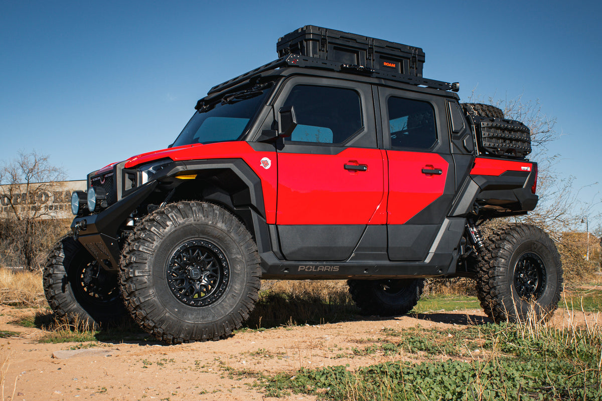 Hostile H133 Glamis wheels installed on a red Polaris Xpedition adventure build. Hostile manufacturer gallery.